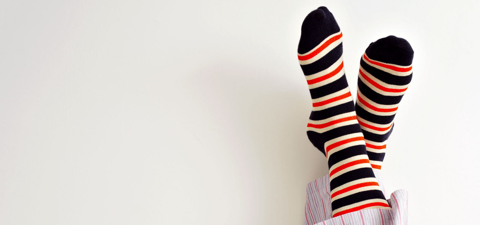 feet with striped socks on lounging up in the air